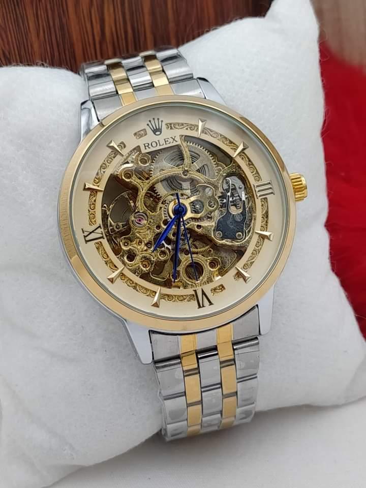 Men’s Silver Automatic Stainless Steel Watch – Rose Gold Face, Water Resistant, Glass Back .