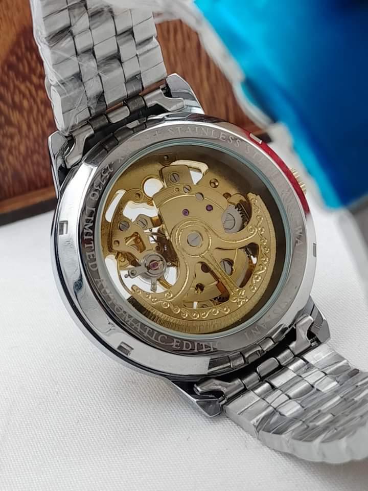 Men’s Silver Automatic Stainless Steel Watch – Rose Gold Face, Water Resistant, Glass Back .