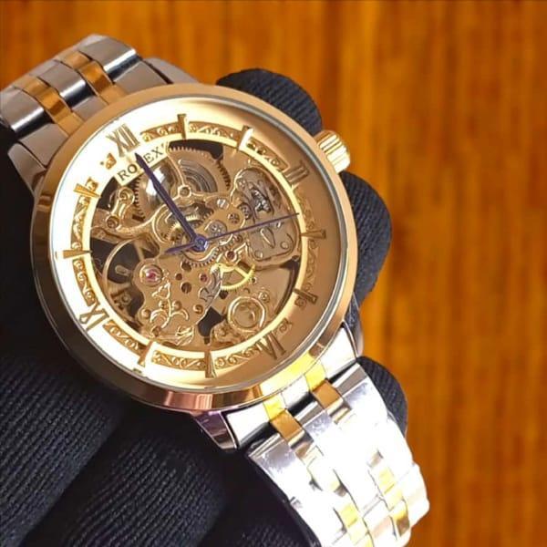 Men’s Silver Automatic Stainless Steel Watch – Rose Gold Face, Water Resistant, Glass Back .