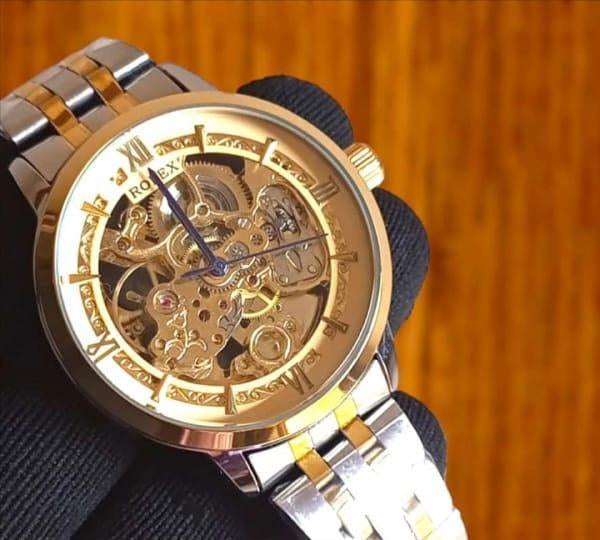 Men’s Silver Automatic Stainless Steel Watch – Rose Gold Face, Water Resistant, Glass Back .